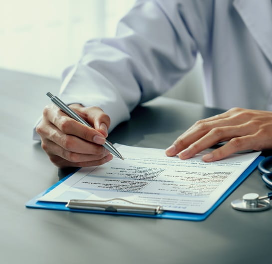 Consultant working on documents related to clinical strategy and planning