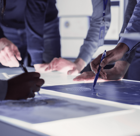 Professionals brainstorming together around a table.