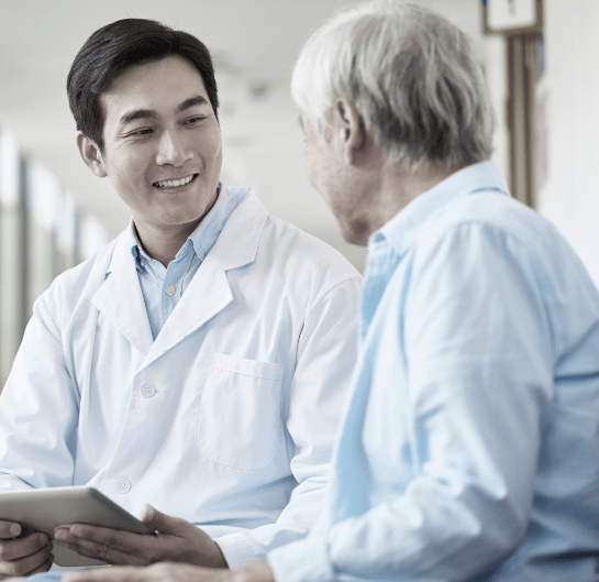 Healthcare professional and patient sitting together.