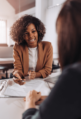Two people sitting and talking together.