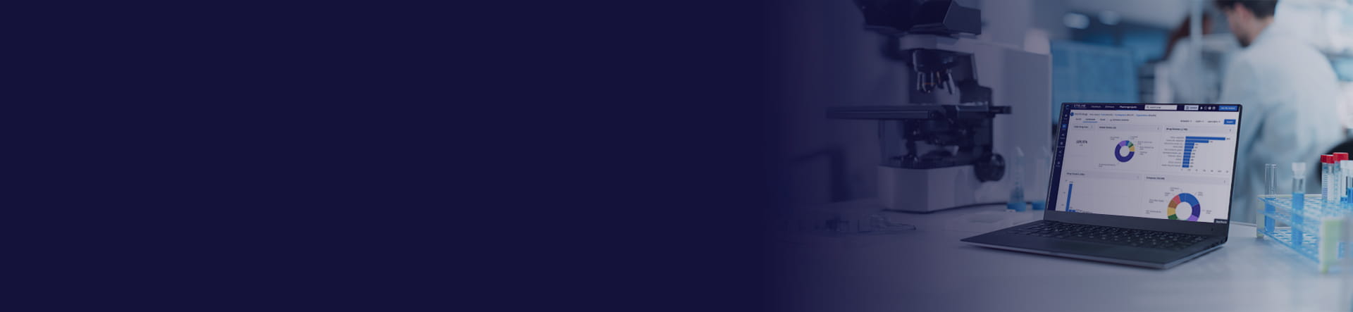 Laptop on a desk, with the Pharmaprojects dashboard on the screen, in a research laboratory.