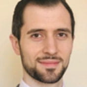 Headshot of Luca Parisi.