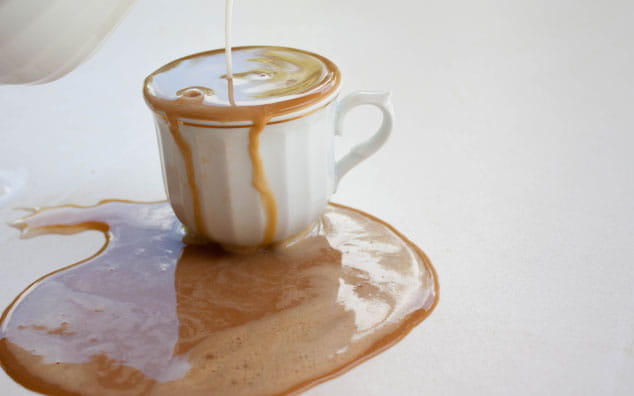 Overflowing cup of coffee.