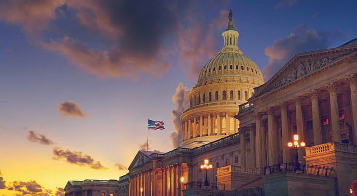 The United States Capitol building at sunset.
