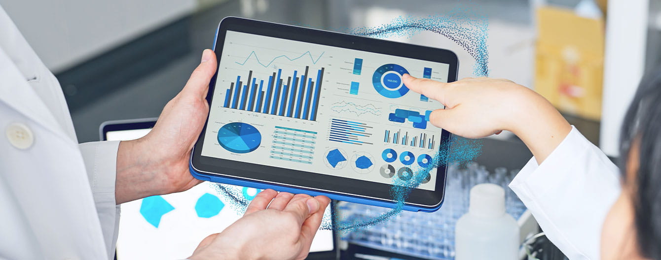 Group of researchers looking at tablet data in the lab