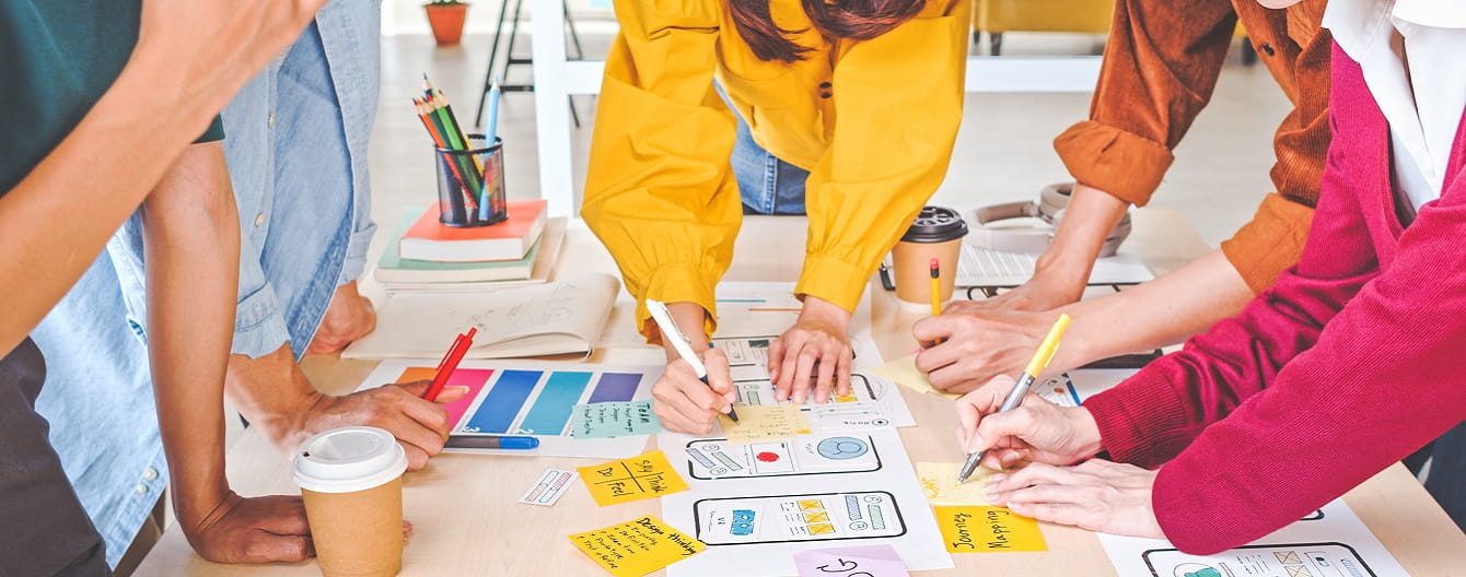 Group of people collaborating around a table.