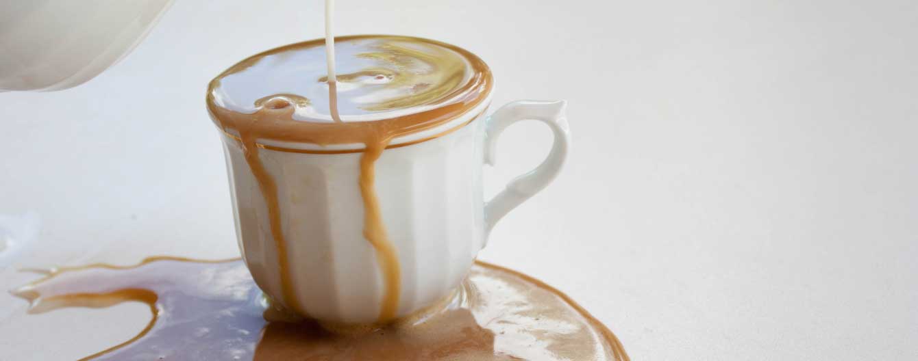 Overflowing cup of coffee.