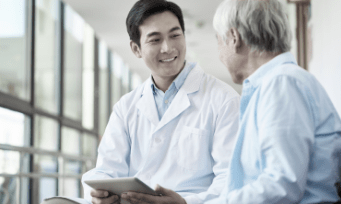 Healthcare professional and patient sitting together.